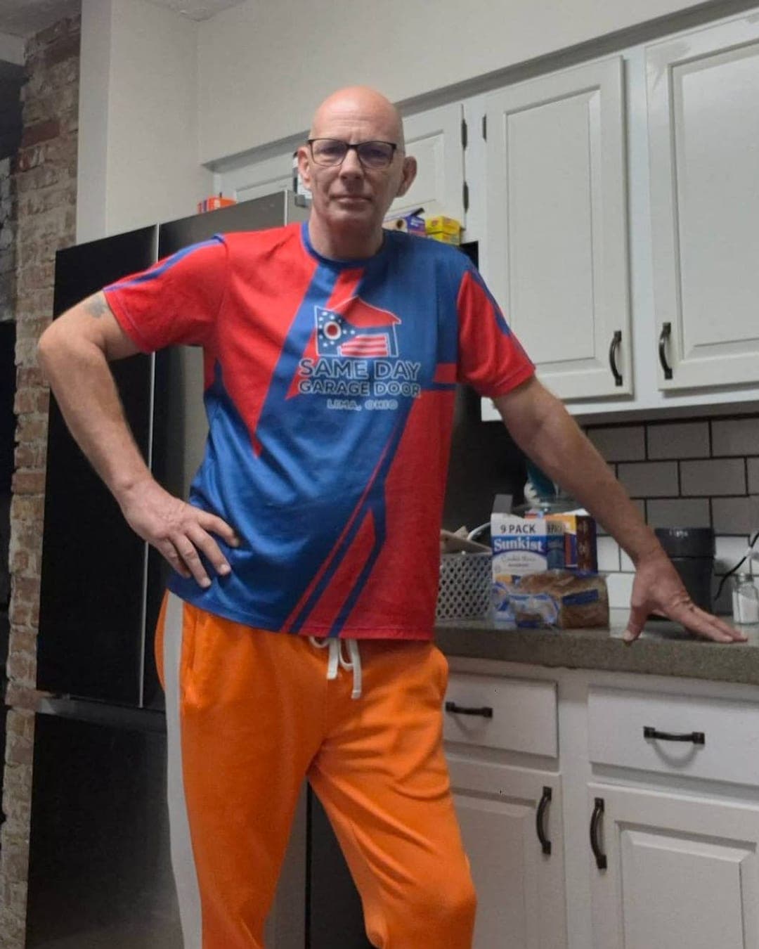 James Lanham, owner and founder of Same Day Garage Door in Lima, Ohio, wearing a Same Day Garage Door shirt